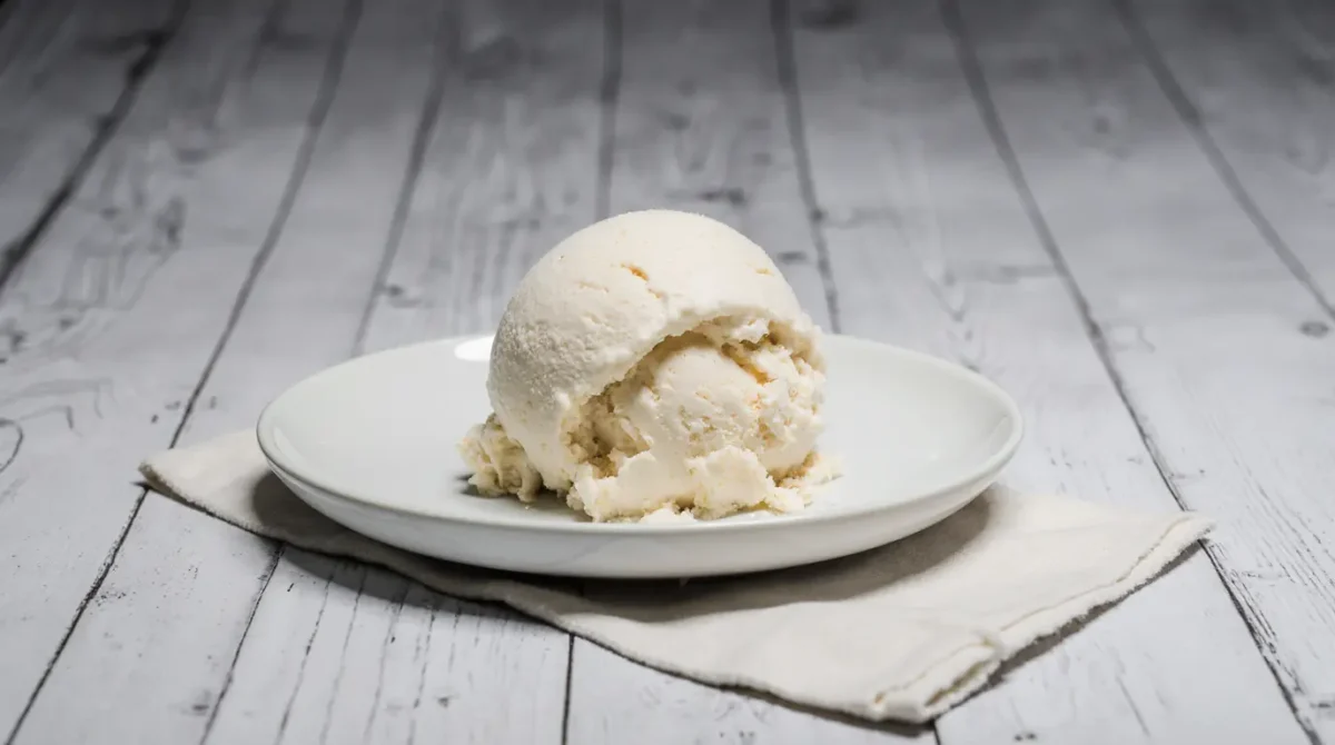 Freshly made cottage cheese ice cream keto with creamy texture on white plate