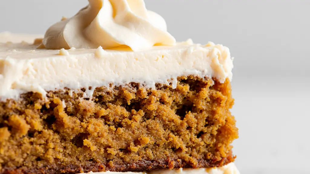 Close-up view of Pumpkin Bars with Cream Cheese Frosting frosting technique with creamy smooth texture