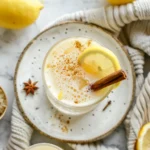Homemade mounjaro recipe final drink overhead in a clear glass with lemon and cinnamon garnish