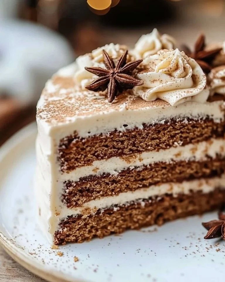 Moist Christmas spice cake with eggnog buttercream decoration on a holiday table