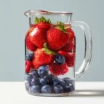 berry blast detox water recipe for weight loss with strawberries blueberries raspberries